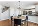 Inviting dining area with a kitchen view, ideal for casual meals and entertaining guests at 4241 Brookwood Pl, Highlands Ranch, CO 80130