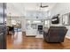 Bright and airy living room with a fireplace, high ceilings, and hardwood floors at 4241 Brookwood Pl, Highlands Ranch, CO 80130