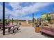 A playground in a park with picnic tables, benches, a climbing structure, and a slide at 4241 Brookwood Pl, Highlands Ranch, CO 80130