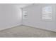 Bright, carpeted bedroom with plantation shutters letting in ample light at 81 Simmental Loop, Castle Rock, CO 80104