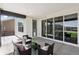 Relaxing covered patio with modern furniture, sliding glass doors, and stylish outdoor lighting perfect for entertaining at 81 Simmental Loop, Castle Rock, CO 80104