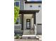 A charming front porch featuring a modern glass door, dark pillars, and a well-maintained entrance at 81 Simmental Loop, Castle Rock, CO 80104