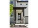 A welcoming front entrance shows a porch with a black frame door and concrete steps at 81 Simmental Loop, Castle Rock, CO 80104