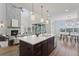 Modern kitchen with a large island, pendant lighting, and an open layout at 81 Simmental Loop, Castle Rock, CO 80104