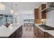 A well-appointed kitchen with quartz countertops, a gas range, and stainless-steel appliances at 81 Simmental Loop, Castle Rock, CO 80104