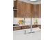 A close up view of a kitchen sink with stainless steel fixtures and a bright white countertop at 81 Simmental Loop, Castle Rock, CO 80104