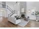 Spacious living room with a fireplace, high ceilings, and a staircase at 81 Simmental Loop, Castle Rock, CO 80104