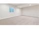 Bright finished basement with carpeting, window and recessed lighting at 21127 E 62Nd Dr, Aurora, CO 80019