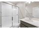 Bathroom featuring a glass-enclosed shower, modern vanity, and sleek fixtures at 21127 E 62Nd Dr, Aurora, CO 80019