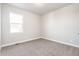 Bright bedroom with soft carpet and a window for ample natural light at 21127 E 62Nd Dr, Aurora, CO 80019