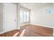 Bright foyer features a white front door, hardwood floors and lots of natural light at 21127 E 62Nd Dr, Aurora, CO 80019