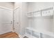 Spacious mudroom featuring a built-in bench and coat hooks for organization at 21127 E 62Nd Dr, Aurora, CO 80019