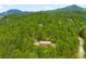 Beautiful mountain home nestled among lush green trees offering privacy and scenic views at 9633 Fox Valley Dr, Morrison, CO 80465