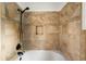 Updated bathroom with tile surround and inset shower niche at 9633 Fox Valley Dr, Morrison, CO 80465