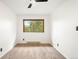 Bright bedroom features a ceiling fan and window with a scenic view of trees at 9633 Fox Valley Dr, Morrison, CO 80465