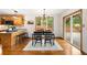 A dining area with sliding doors offers natural light, and kitchen bar seating at 9633 Fox Valley Dr, Morrison, CO 80465