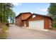 Two story home with an attached garage and basketball hoop above it's door at 9633 Fox Valley Dr, Morrison, CO 80465