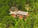 An exterior view of a two story home surrounded by lush trees at 9633 Fox Valley Dr, Morrison, CO 80465