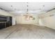 Spacious garage with ample storage, shelving, and a white refrigerator at 9633 Fox Valley Dr, Morrison, CO 80465