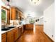 A spacious kitchen features stainless steel appliances, wood cabinets, and natural light at 9633 Fox Valley Dr, Morrison, CO 80465
