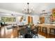 An open concept living area with wood floors, kitchen and natural lighting at 9633 Fox Valley Dr, Morrison, CO 80465