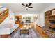 An open concept floor plan shows a modern living room with fireplace and hardwood floors at 9633 Fox Valley Dr, Morrison, CO 80465