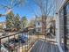 Cozy balcony with metal railings overlooking parking lot, street and neighboring building; perfect for outdoor relaxation at 13844 E Lehigh Ave # H, Aurora, CO 80014