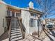 This exterior of this townhouse features a staircase leading up to the units at 13844 E Lehigh Ave # H, Aurora, CO 80014