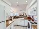 This bright kitchen has white cabinets and opens to the dining area at 13844 E Lehigh Ave # H, Aurora, CO 80014