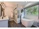 Spa-like bathroom features a soaking tub and tiled shower at 1607 Garnet St, Broomfield, CO 80020