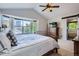 Primary bedroom boasts vaulted ceilings, large bay windows, and adjoins the bathroom at 1607 Garnet St, Broomfield, CO 80020