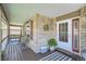 Inviting front porch with brick accents, seating, and a decorative rug at 1607 Garnet St, Broomfield, CO 80020