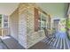 Covered porch with seating area and view of the home's exterior at 1607 Garnet St, Broomfield, CO 80020