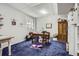Finished basement room featuring a large desk and blue carpet at 1607 Garnet St, Broomfield, CO 80020