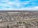 Expansive aerial view featuring a lake surrounded by a densely populated city with residential and commercial buildings at 677 Vrain St # 10, Denver, CO 80204