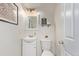 Clean bathroom with white fixtures and ample lighting at 677 Vrain St # 10, Denver, CO 80204