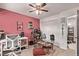 Charming bedroom with a large closet, red accent wall, and decorative furnishings at 677 Vrain St # 10, Denver, CO 80204