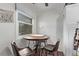 Bright eating area with natural light and seating for three at 677 Vrain St # 10, Denver, CO 80204