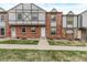 Inviting townhouse exterior with a brick facade, Tudor details, and a pleasant walkway at 677 Vrain St # 10, Denver, CO 80204