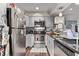 Modern kitchen with stainless steel appliances and ample counter space at 677 Vrain St # 10, Denver, CO 80204