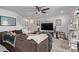 Comfortable living room with a ceiling fan, plush sofa, and staircase to the upper level at 677 Vrain St # 10, Denver, CO 80204