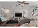 Inviting living room with a large TV, ceiling fan, and cozy seating at 677 Vrain St # 10, Denver, CO 80204