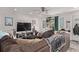 Cozy living room featuring a large TV, ceiling fan, and comfortable, oversized seating at 677 Vrain St # 10, Denver, CO 80204