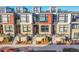 Row of modern townhouses with private patios and rooftop decks at 6769 E Lowry Blvd, Denver, CO 80230