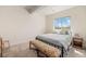 Bedroom with a queen-size bed, bench, and view out of the large window at 1282 Eldorado Dr, Superior, CO 80027