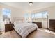 Bright and airy bedroom with large windows, hardwood floors, and comfortable furnishings creating a relaxing retreat at 1282 Eldorado Dr, Superior, CO 80027