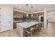 Modern kitchen with stainless steel appliances, a large center island with seating, and stylish backsplash at 1282 Eldorado Dr, Superior, CO 80027