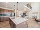 Spacious kitchen with stainless appliances, large island with seating, and easy access to the dining and living areas at 1282 Eldorado Dr, Superior, CO 80027