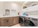 Well-organized laundry room with modern appliances, ample counter space, and stylish cabinetry at 1282 Eldorado Dr, Superior, CO 80027