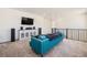 Cozy upstairs living room featuring a plush sofa and entertainment center for relaxed Gathering gatherings at 1282 Eldorado Dr, Superior, CO 80027
